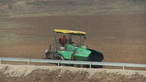 Asphalt paver on the road Stock-Footage 71113617