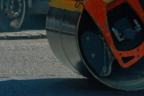 Asphalt paver at work close up Stock Photos