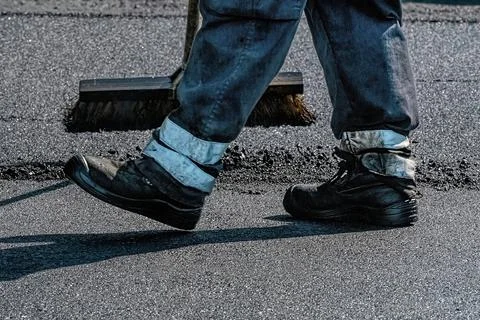 Asphalt paver at work close up Stock Photos