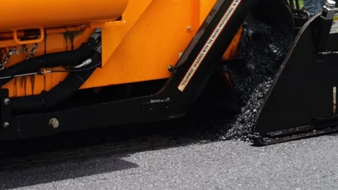 Asphalt paving machine placing a layer of Asphalt 2 Stock Footage 276300874