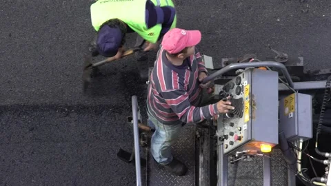 Asphalt paving machine workers in Lisbon street, Portugal Stock-Footage 134212109
