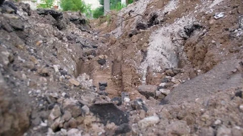 Asphalt repairs.  Construtction site close up. Deeply dug trench in broken .. Stock-Footage 339547467