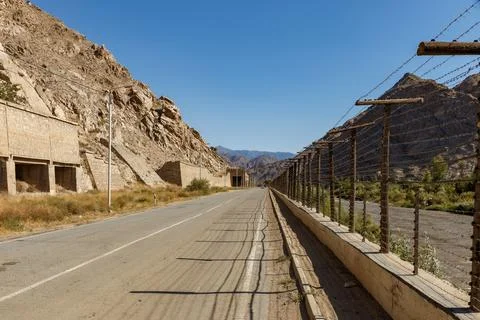 Asphalt road along Aras river marking the border between Armenia and Iran Stock Photos