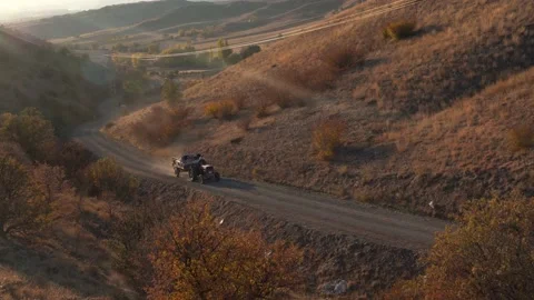 Asphalt road between hilly area with tractor. Stock Footage 164196094