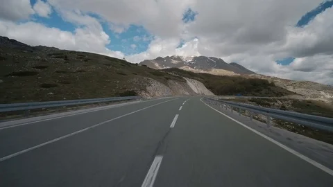 Asphalt road with car passing through forest in region in summer Video stock 78682346