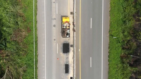 Asphalt road maintenance operator job Stock Footage 95792332