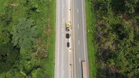 Asphalt road maintenance operator job Video stock 98345183