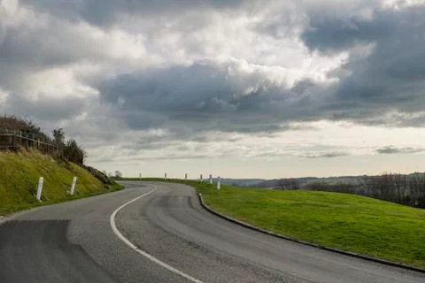 Asphalt road passing through the fields in the region of Normandy, France Foto stock