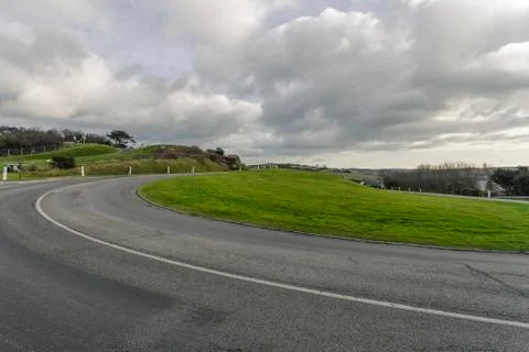 Asphalt road passing through the fields in the region of Normandy, France Stock Photos