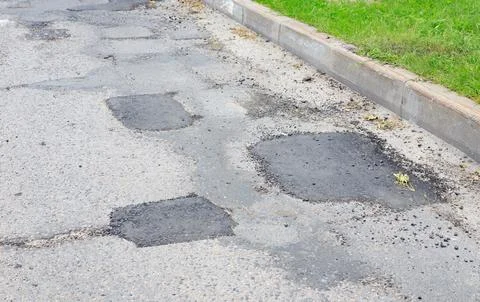 Asphalt road patching and pothole repair texture, grey street pavement surf.. 写真素材