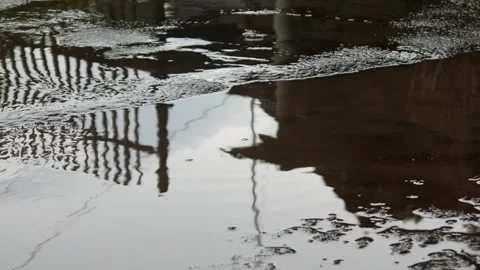Asphalt road with raindrops falling. asphalt road with puddles after rain Stock Footage 304770697