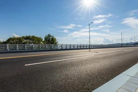 Asphalt road with sky cloud background Stock Photos