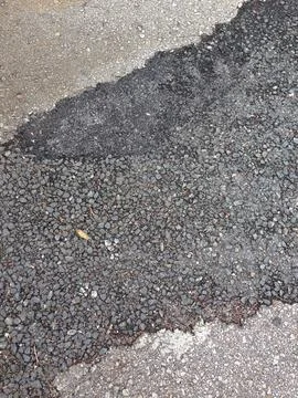 Asphalt road surface with patchwork texture Stock Photos