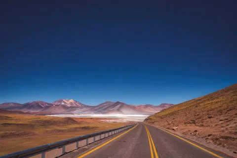 Asphalt road through the Atacama desert, Chile Stock Photos