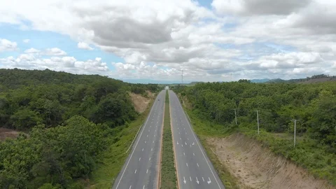 Asphalt road through mountain and forest Stock Footage 90927421