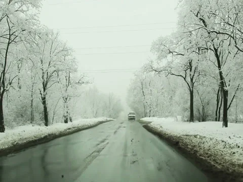 Asphalt road through the snowy winter morning park Stock Footage 35043437