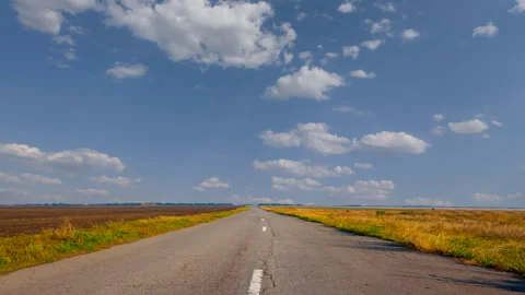 Asphalt road through a steppe time lapse scene Stock Footage 266128053