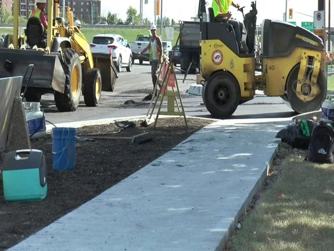 Asphalt Roller with Men with Rakes in Background 스톡 동영상 80206925