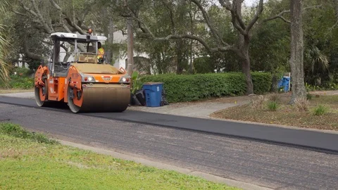 Asphalt roller rolls over hot asphalt Stock Footage 127645712