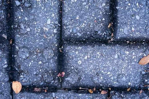 Asphalt Sidewalk Block Texture with Pebbles and Debris Stock Photos