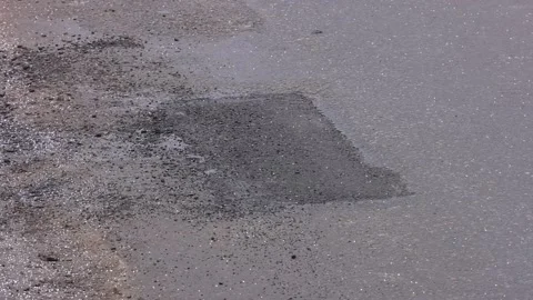 Asphalt tarmac patch on concrete ground repair pavement road in parking lot Stock Footage 237213281