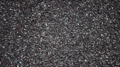 Asphalt texture background with tiny dark stones Stock Photos