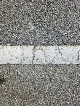 Asphalt texture background with white stripe in the middle Stock Photos