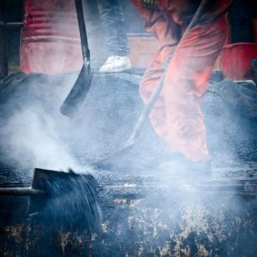 Asphalt worker Stock Photos
