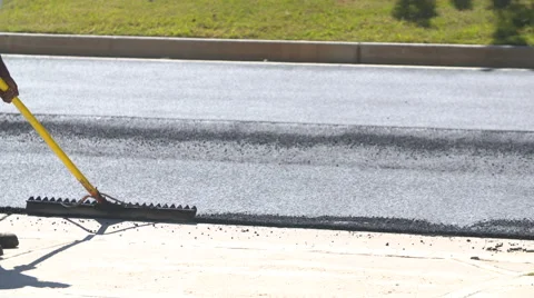 Asphalt Workers Clean Area for Pavement Stock Footage 68653385