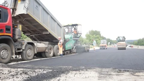 Asphalting new section of roadway. Stock Footage 225930364