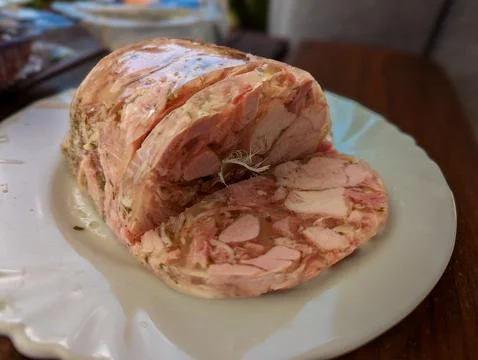 Aspic meat loaf with a feather Stock Photos