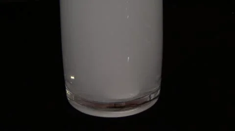 Aspirin dissolves in water on black background Stock Footage 10825729