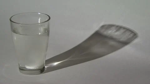 Aspirin dissolves in water Stock Footage 10825736