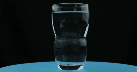Aspirin or effervescent pill dropping into a glass of water Stock Footage 108135259