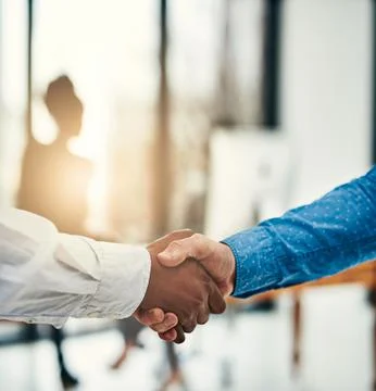 Aspiring to greatness together. Closeup shot of businesspeople shaking hands in Stock Photos
