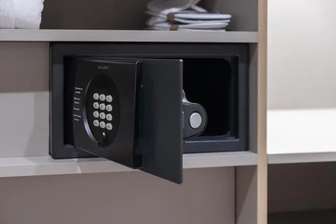Assa Abloy electronic safe with an open door installed in a hotel wardrobe for Stock Photos