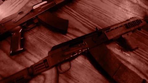 Assault rifles in red grunge elements non looping Stock Footage 201693385