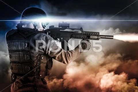 Assault soldier with rifle on apocalyptic clouds, firing Stock Photos