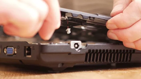 Assebling a laptop. Connecting a cable - 4K Stock Footage 76940331
