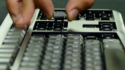 Assemble the keyboard and put the buttons in the grooves. Fast moving. Stock-Footage 85076888