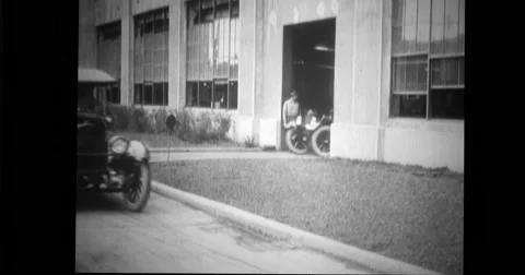 Assembled car being driven out of the plant for final testing Stock Footage 43388828
