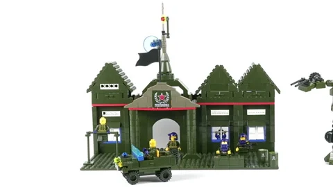 Assembled Military Model Commandant's Office And Robot Transformer On A White Ba Stock Footage 172536692