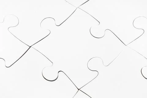 Assembled white puzzle as background, closeup Stock Photos