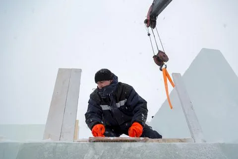 Assembler at the construction site with a brush in his hands Fotos Stock
