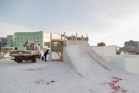 Assembler at the construction site with a brush in his hands 스톡 사진