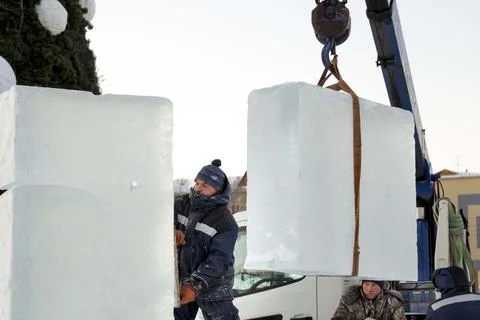 Assembler at the construction site with a brush in his hands 스톡 사진
