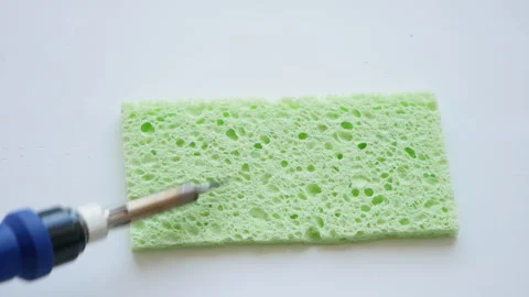 The assembler of radio-electronic components prepares the soldering iron Stock Footage 240894610