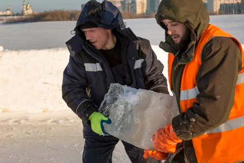 Assemblers are in the hands of the ice block 写真素材