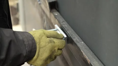 Assembler's hands tightening a Nut onto a Bolt Video stock 261500528