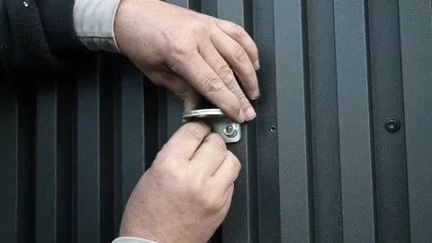 Assembler's hands tightening a Nut onto a Bolt Video stock 261500535